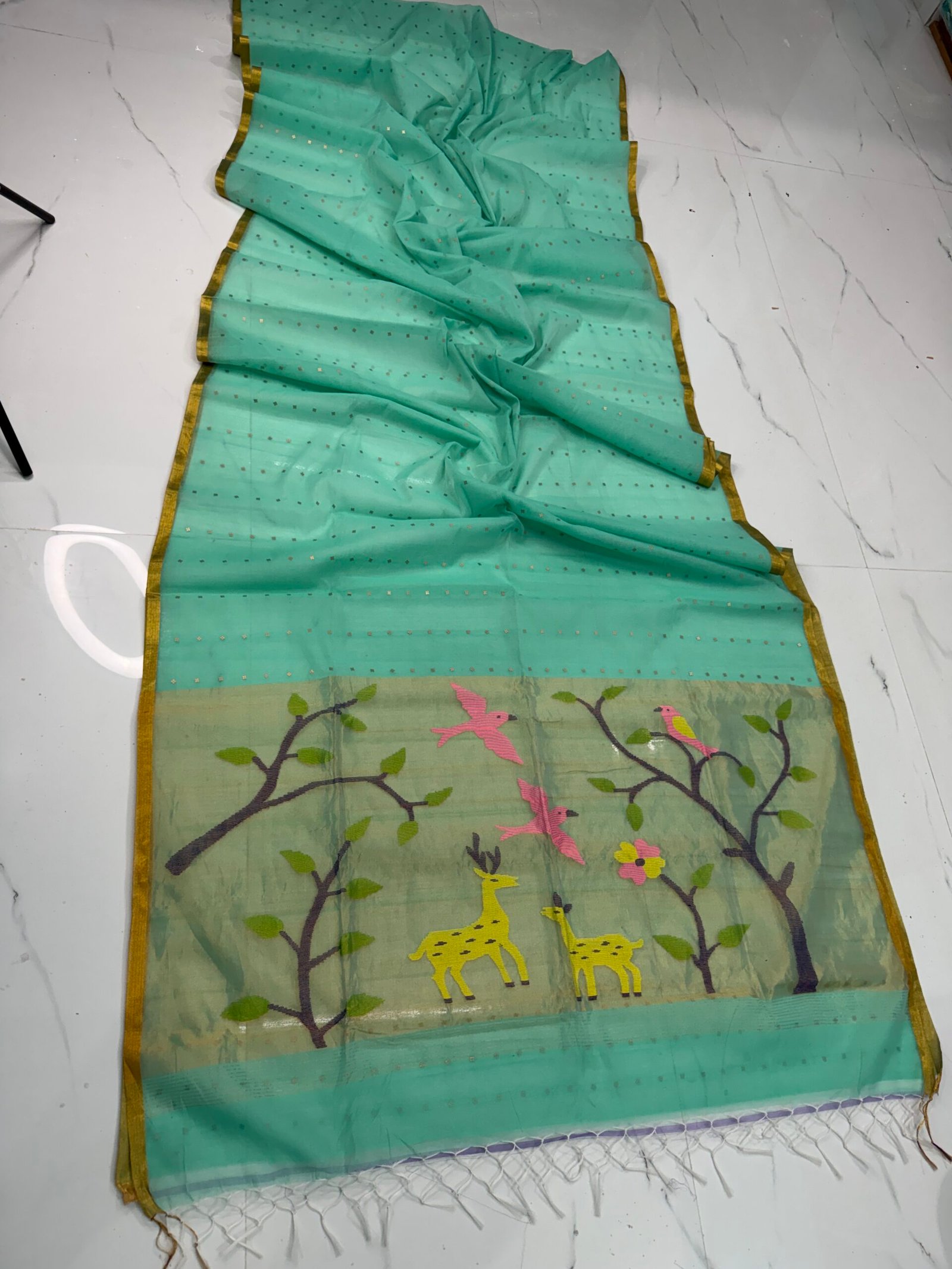 Exquisite Muslin Saree with Sequence Body and Handwoven Animal Motifs